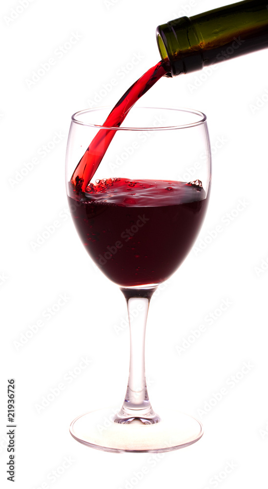 Red wine pouring from a wine bottle Red wine pouring from a wine bottle
