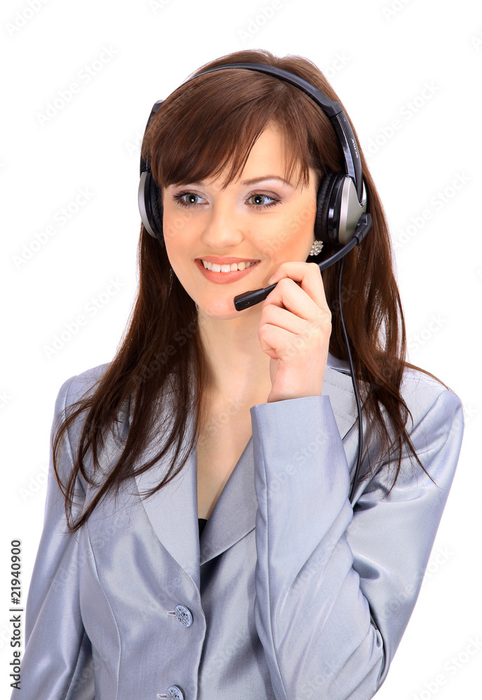 Woman wearing headset in office; could be receptionist. Woman wearing headset in office; could be receptionist.