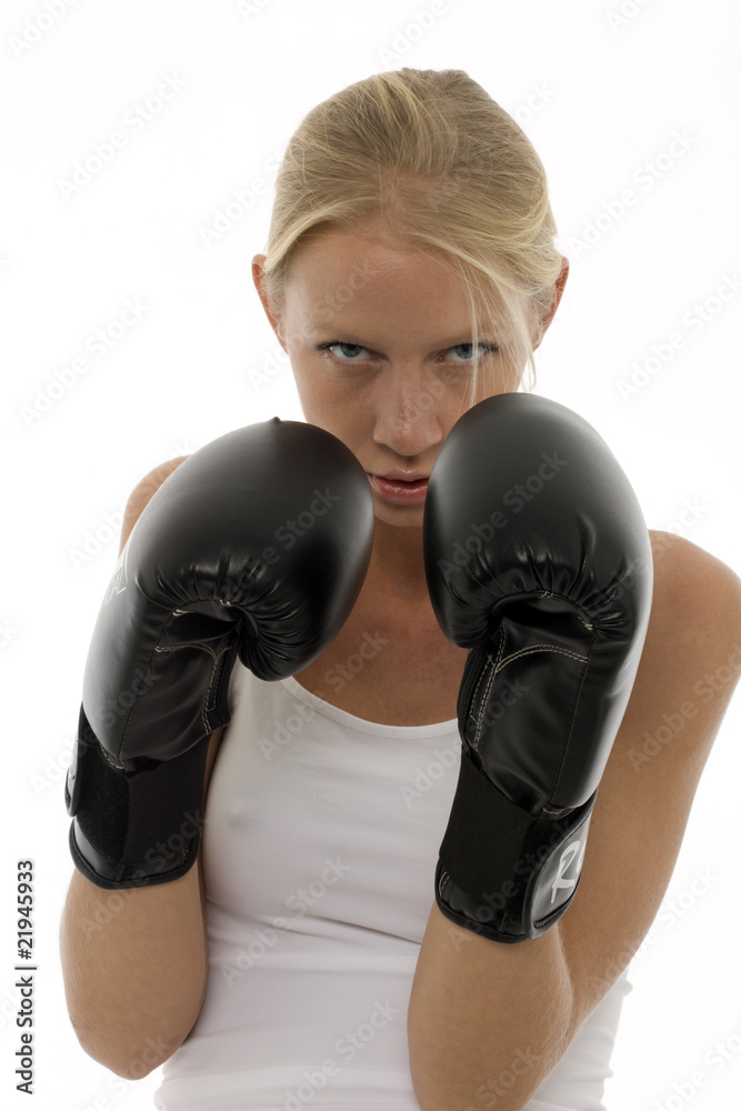 young woman who does kick boxing with boxing gloves