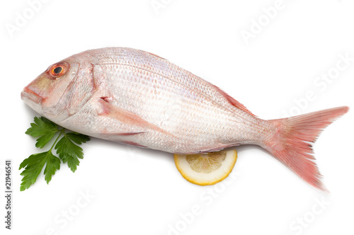 red snapper with slice lemon and parsley