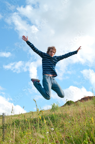 men jumping against summer landscape