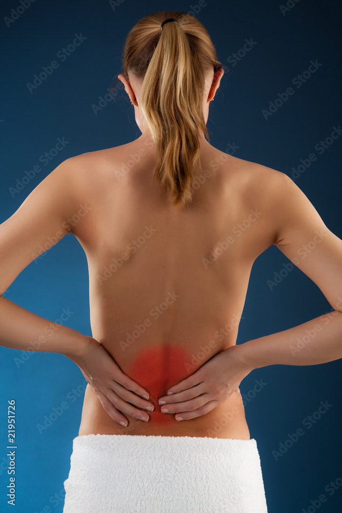 Woman massaging pain back Woman massaging pain back