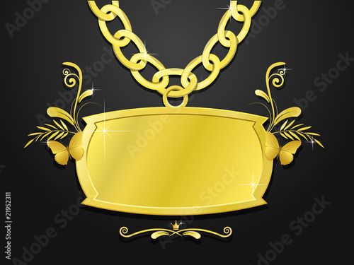 gold set of chain and decoratde plaque photo