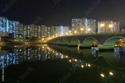 bridge and partment Buildings in Hong Kong at night. photo