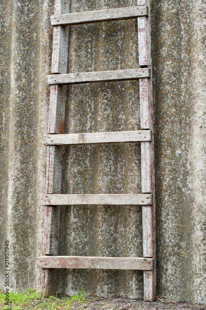 wooden ladder near old roofing slate wooden ladder near old roofing slate