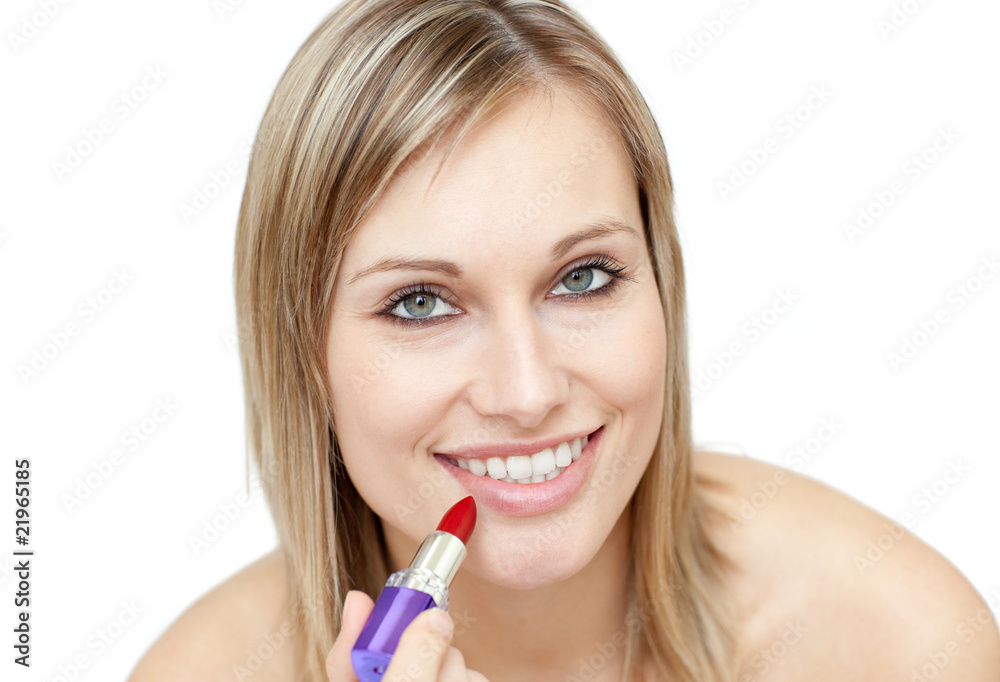 Glowing woman putting red lipstick Glowing woman putting red lipstick