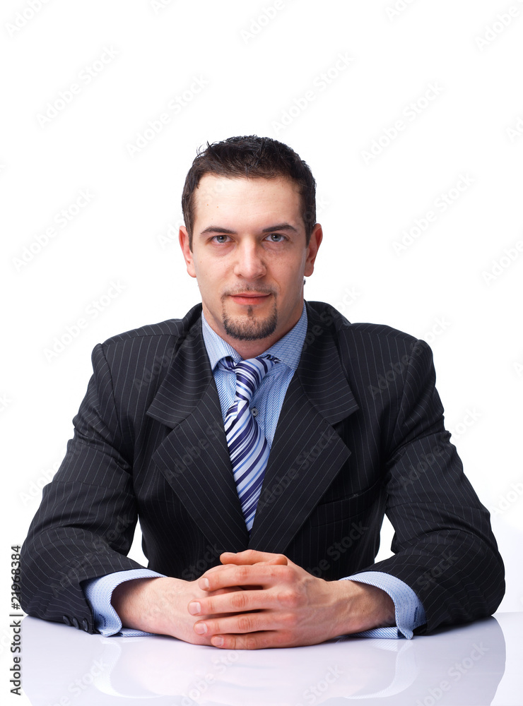 Businessman Sitting With Folded Hands. Businessman Sitting With Folded Hands.