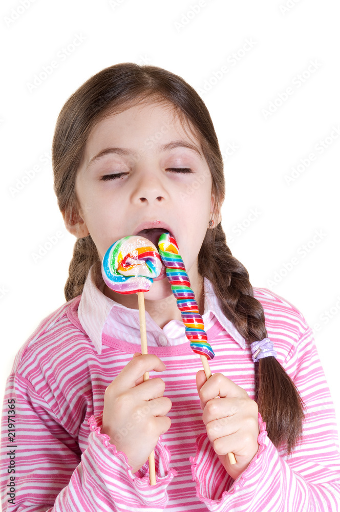 child with lollipop on white background
