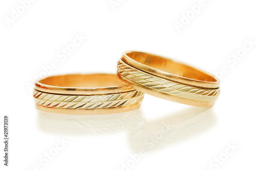 Two golden wedding rings. Isolated on white