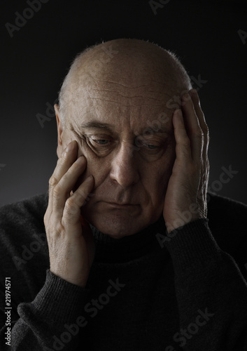 Stressed senior man with headeach