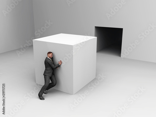 businessman pushing cube