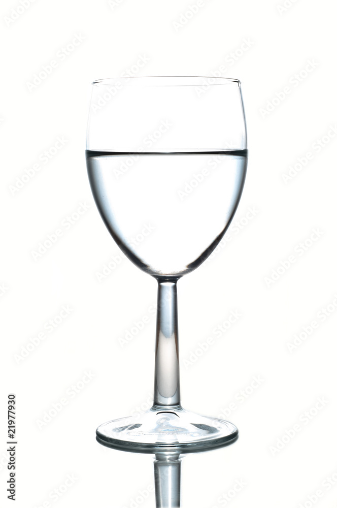 Wineglass half-full of water isolated on white Wineglass half-full of water isolated on white