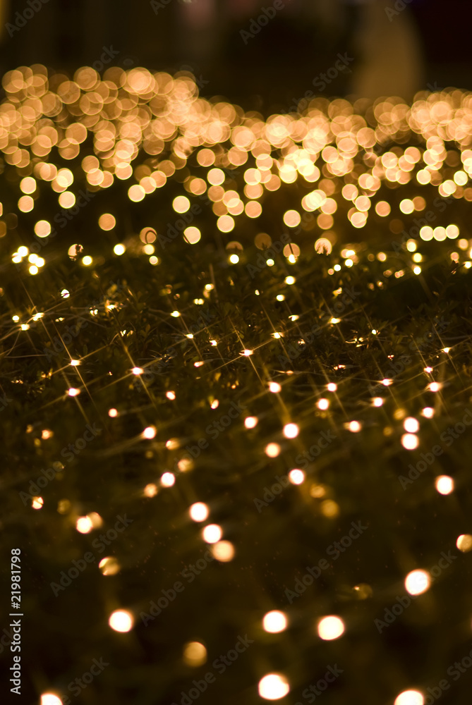 Defocused yellow light effect against black background Defocused yellow light effect against black background