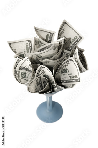 Bouquet of dollar bills in wineglass over white background