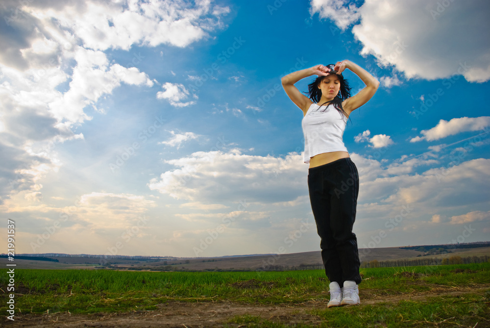 young athletic woman at spring field landscape young athletic woman at spring field landscape