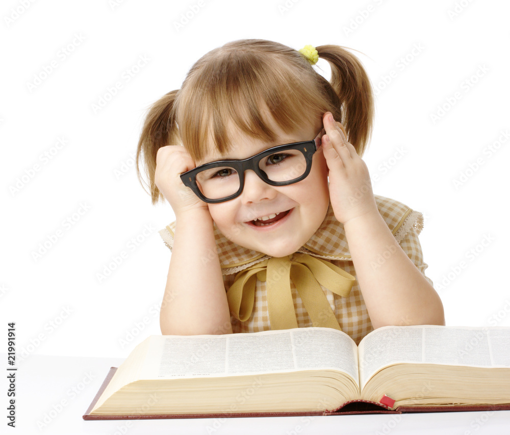 Happy little girl with book wearing black glasses