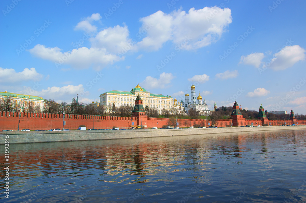 Moscow Kremlin and river under blue sky with white clouds Moscow Kremlin and river under blue sky with white clouds