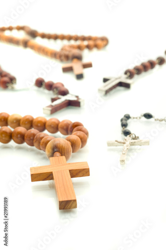Religion diversity - rosary beads over white