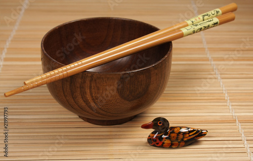 bowl with chopsticks and ornamental duck photo