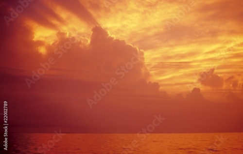 golden sunset in orange color in the sea ocean © lunamarina