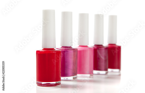 Assorted fingernail polish on a white background