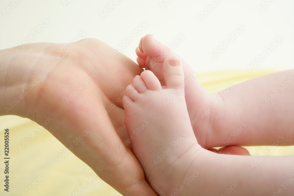 baby feet in mother hands playing baby feet in mother hands playing