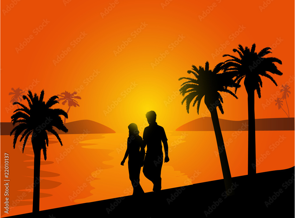 couple in love walking on the beach at sunset