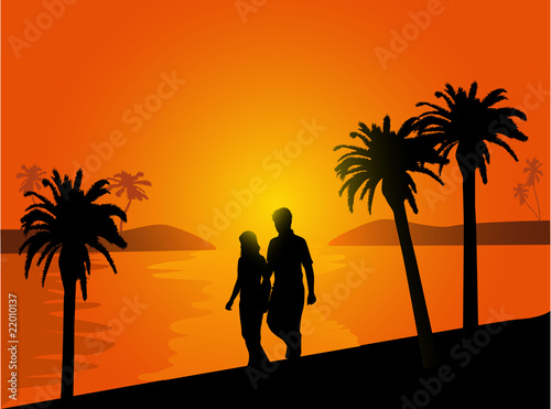 couple in love walking on the beach at sunset
