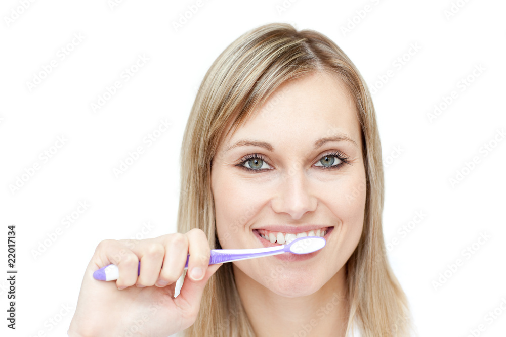 Portrait of a blond woman brushing her teeth Portrait of a blond woman brushing her teeth