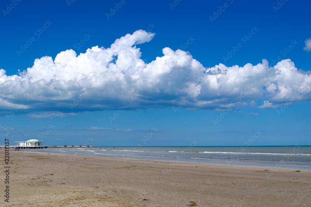 Sea landscape with blue sky and fluffy clouds