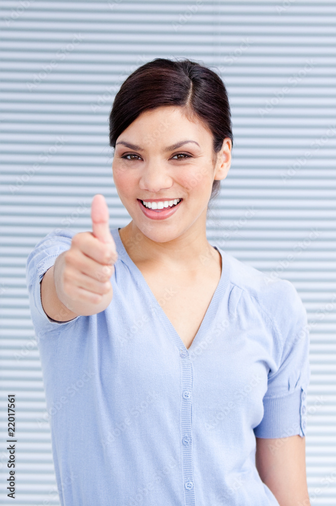Cheerful businesswoman with a thumb up Cheerful businesswoman with a thumb up