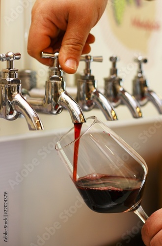 Red wine poured into a glass