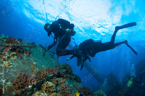 Scuba divers explore the wreck