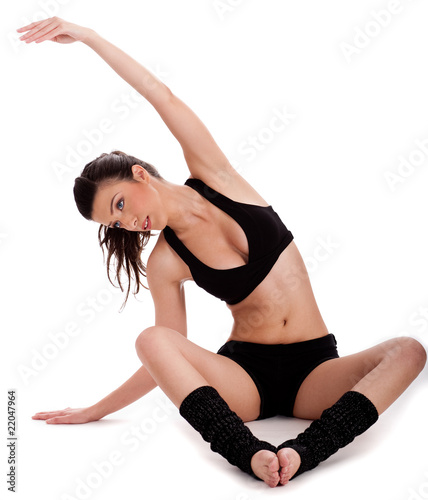 Young beautiful woman doing yogatic exercise photo