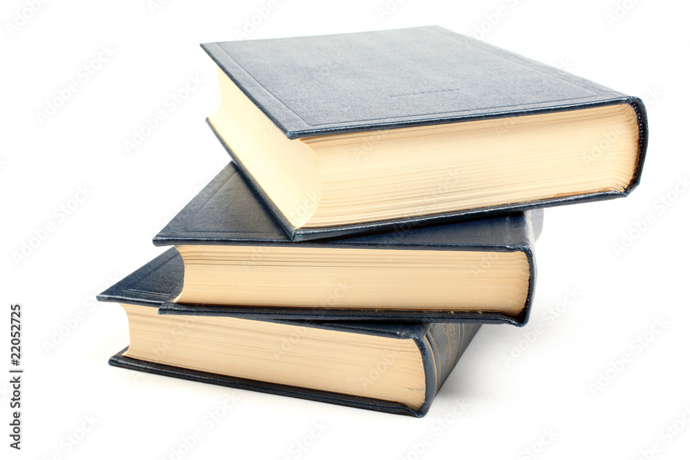 Three old books with yellowed pages isolated on white background Three old books with yellowed pages isolated on white background