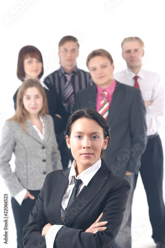 Business group with a young business woman in charge