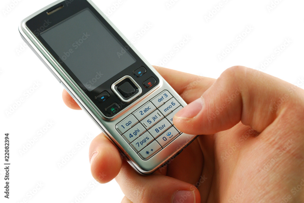 Dialing a mobile phone on a white background. Dialing a mobile phone on a white background.