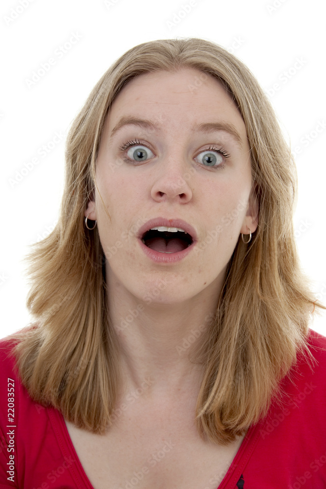 Young woman is looking surprised over white background Young woman is looking surprised over white background