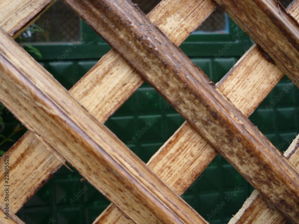 wooden trestle square lattice garden fence with green background wooden trestle square lattice garden fence with green background