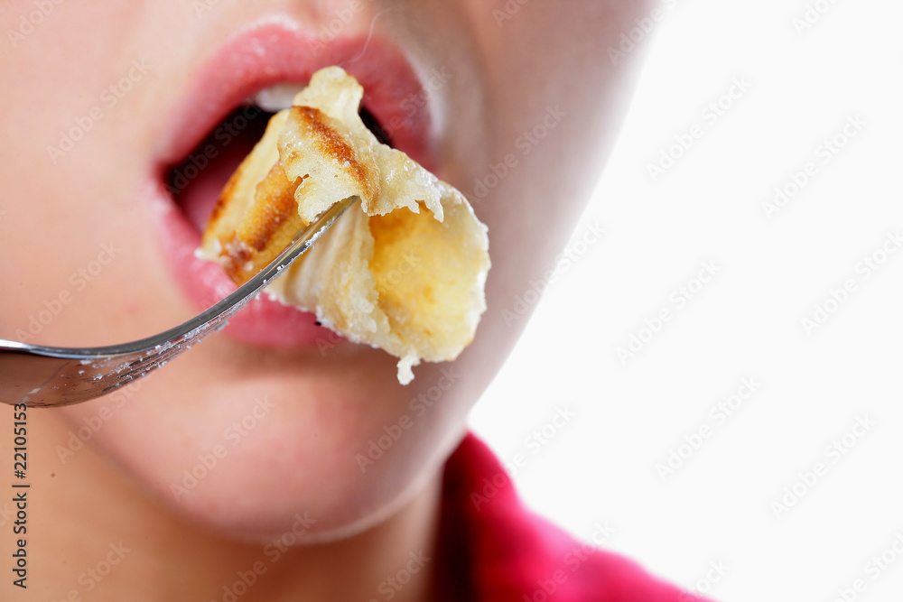 Young Woman Eating a Pancake. Model Released Young Woman Eating a Pancake. Model Released