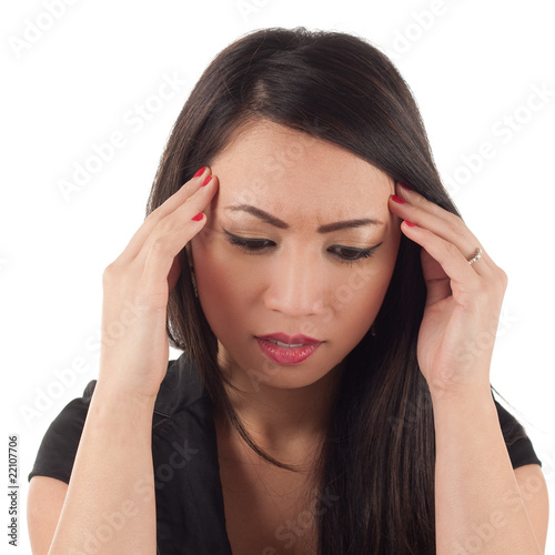 Attractive asian woman with head in hands