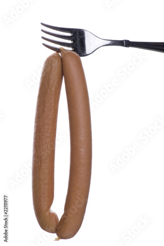 Canvas Print frankfurter on fork on white
