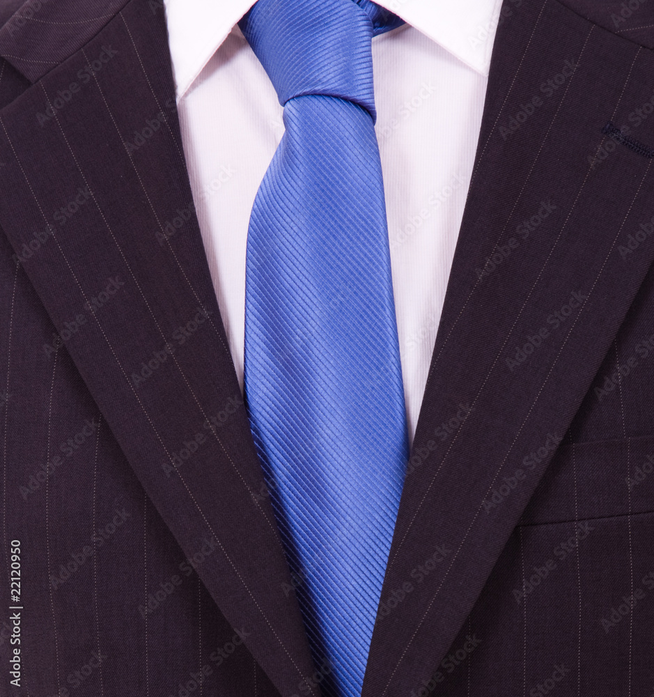 Detail of a Business man Suit with blue tie Detail of a Business man Suit with blue tie