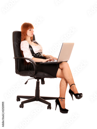 businesswoman in chair with laptop on white background