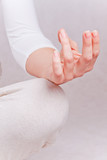 One hand of meditating woman in lotos pose