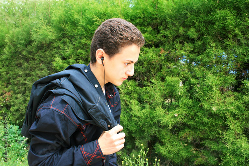 Teen with ear-phone © RUZANNA ARUTYUNYAN