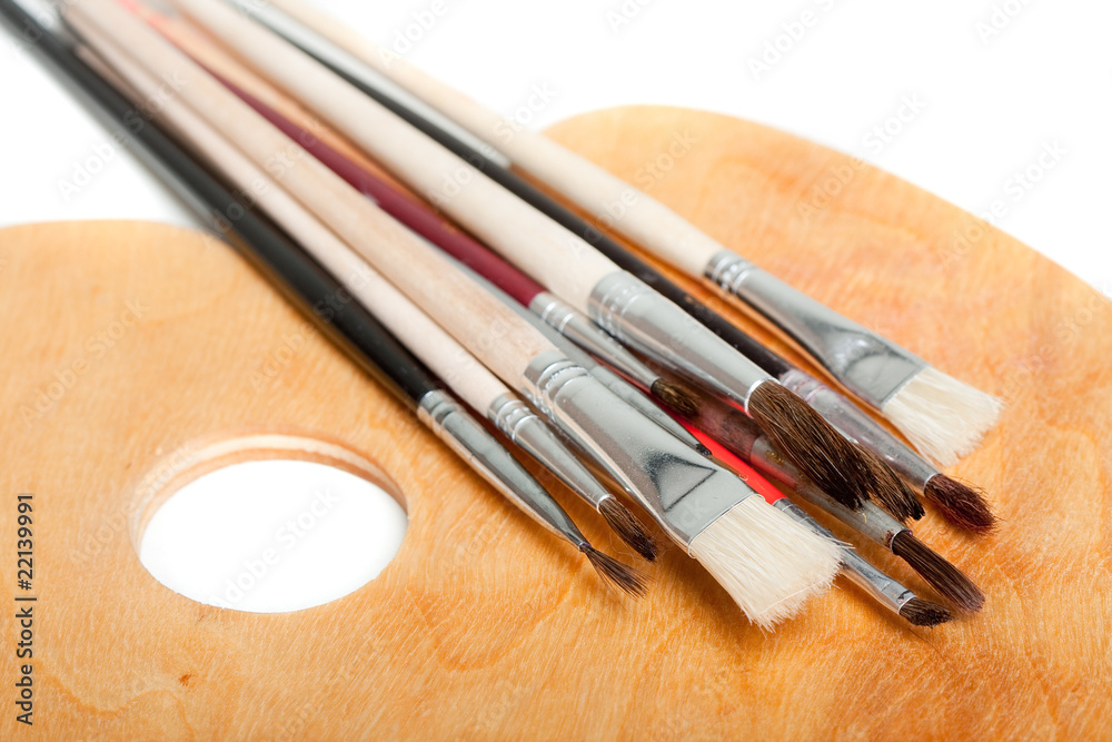 Fototapeta premium Wooden palette with paintbrushes
