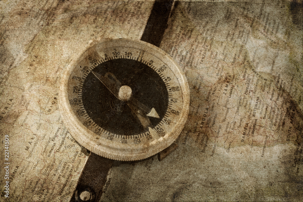 Old compass on map grunge background