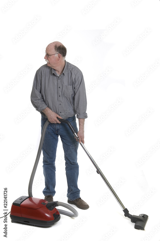 Man is using a vacuum cleaner isolated on white Man is using a vacuum cleaner isolated on white