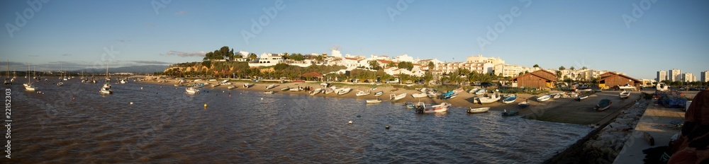 Panorama of a beach with fishing boats in Alvor